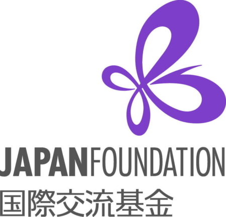 Japan Foundation logo. Dark coloured block capitals with Japanese writing underneath on a white background. Above the writing is a large purple butterfly.