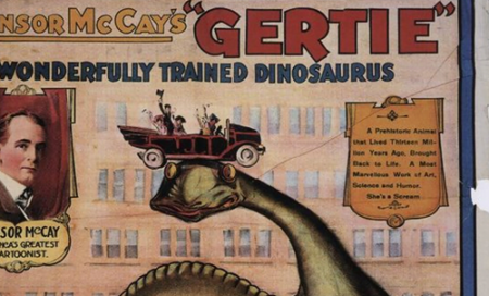 An image of an old comic called, " Windsor McCay's Gertie, The wonderfully trained Dinosaurus." The image contains an illustration of a large dinosaur with a car full of people sitting on its head.