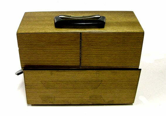 Acoustic Coupler type TC301 (used as early form of modem). A wooden box with a handle at the top.