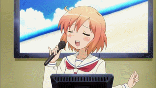 A gif containing a Japanese style animation of a young person singing Karaoke in a small room.