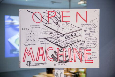 A diagram of a circuit board with the words, " Open Machine" written in red writing over the top of the diagram.
