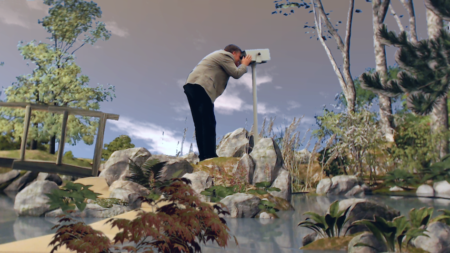 A computer generated image of a Japanese style garden,with a small bridge,a small pond,rocks and small trees. In the middle of this scene is a person looking through a grey telescope.