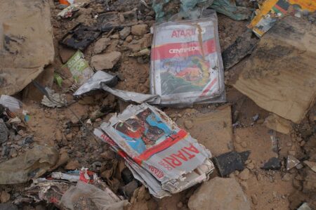 Buried in a landfill are various Atari packaged games.