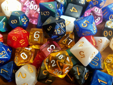 A collection of different coloured,various multi sided dice, used for role playing games.