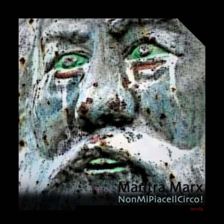 A close up image of an old persons face sculpted out of stone. The face is coloured grey with white facial hair and green tinges across the cheeks and nose, The eyes are coloured green, as are the teeth.