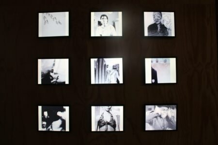 Nine black and white film stills on a black background.