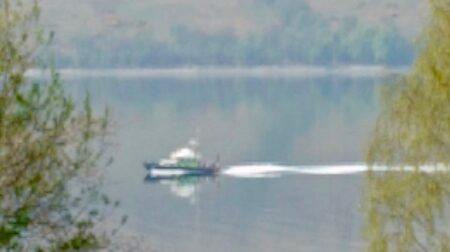 Blurred photograph of a boat on Gare Loch, covertly taken by B.D. Owens.