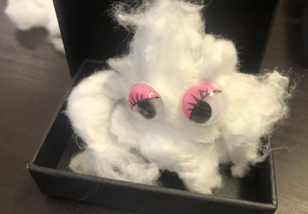 Cotton wool with googly eyes - looks like a cloud