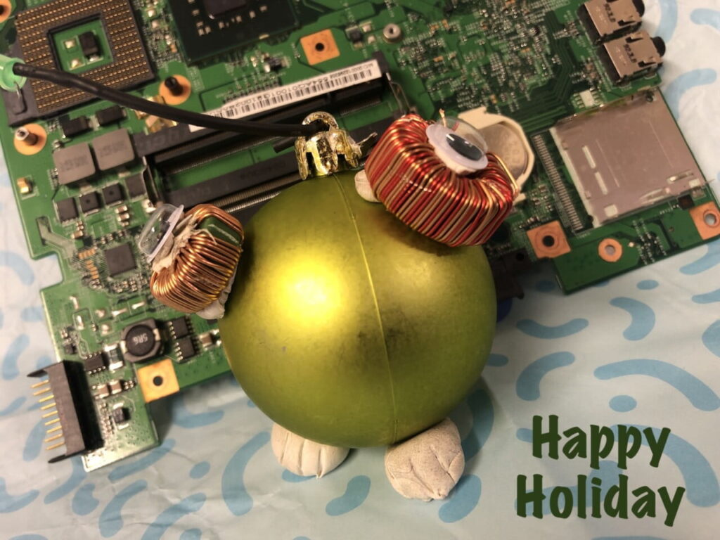 E-waste and a e-waste robot with text Happy Holidays